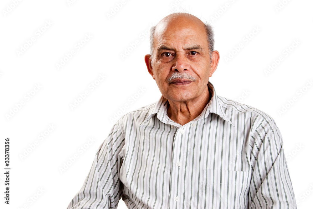Paramedics transport a patient on a stretcher outside a house in snowy conditions.